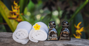 Freshly folded towels and premium shampoo bottles displayed as welcoming vacation rental amenities. Ask ChatGPT
